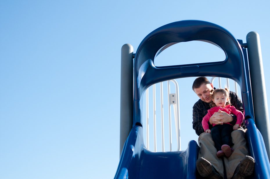 dad with baby on slide