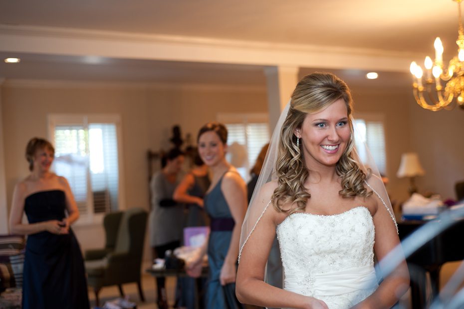 bride looking at herself in mirror