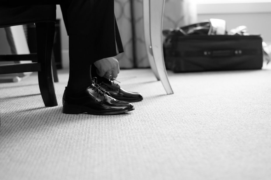 groom tying shoes