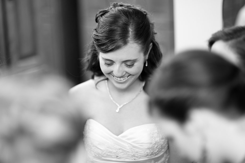 bride and bridesmaids praying before wedding