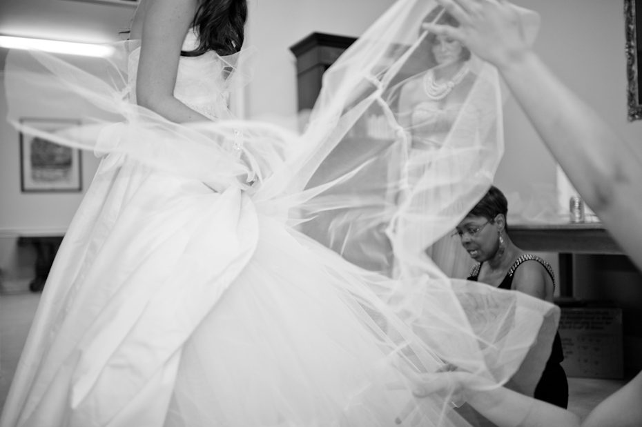Cutting tulle from under wedding dress