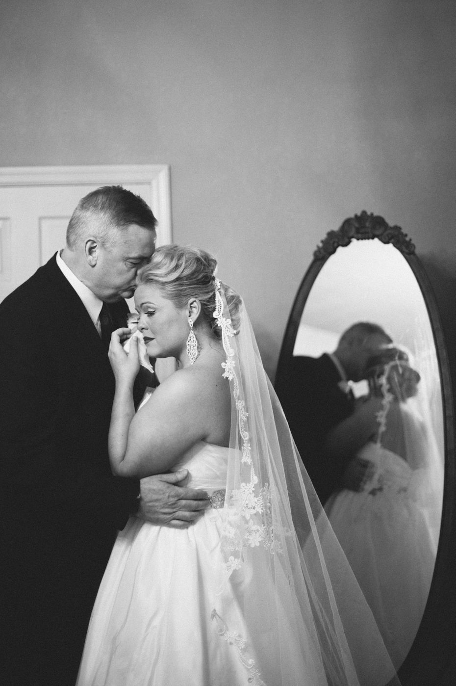 Dad kissing daughter