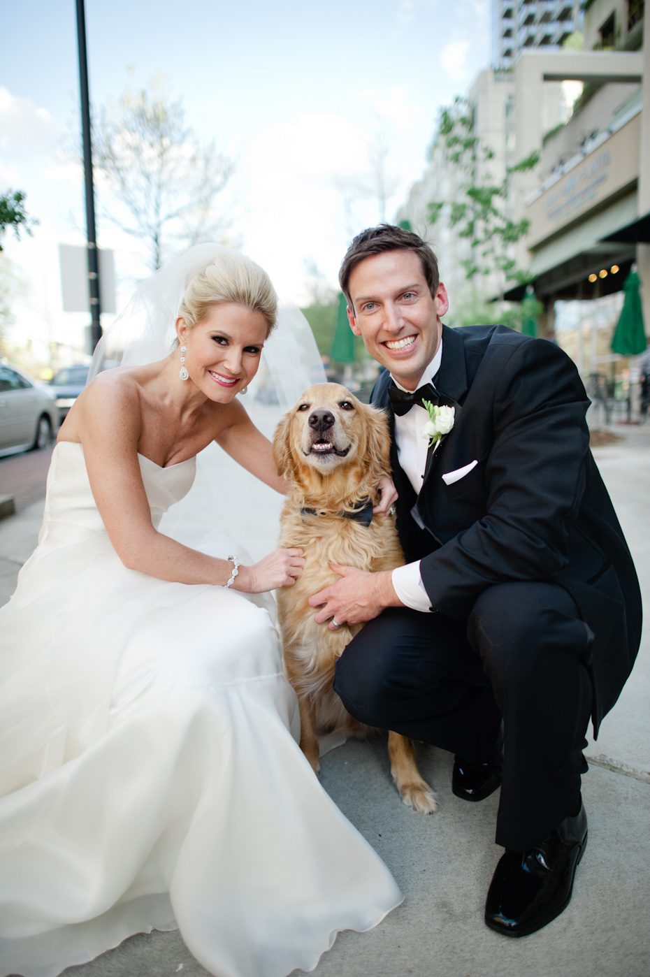 Bride and groom with dog Bride and groom picture with dog at wedding