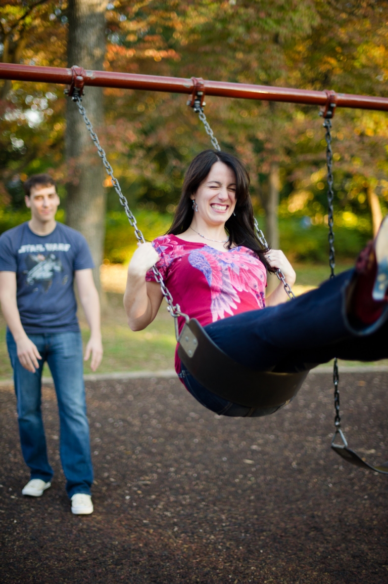 Engagement photo on swing