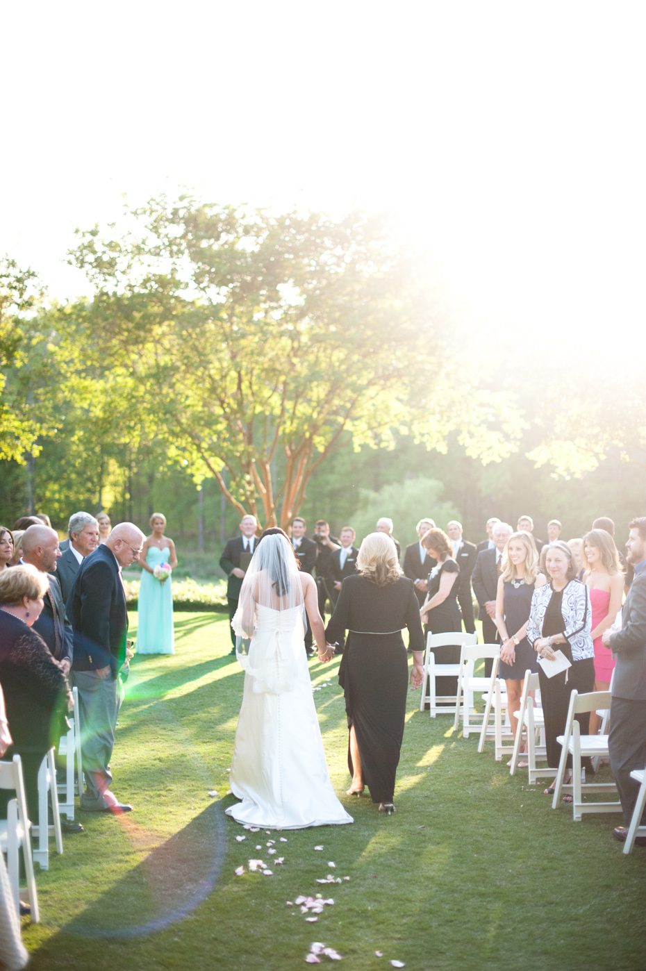 Bride escorted down the aisle by mom