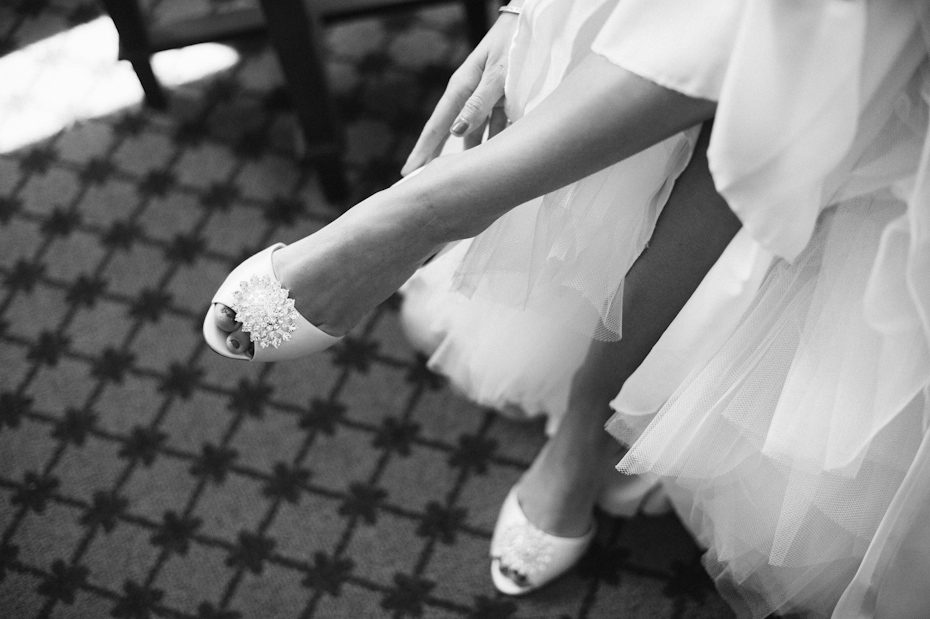 Bride putting on shoes