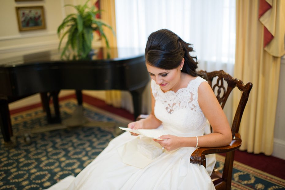 Bride opening gift from groom