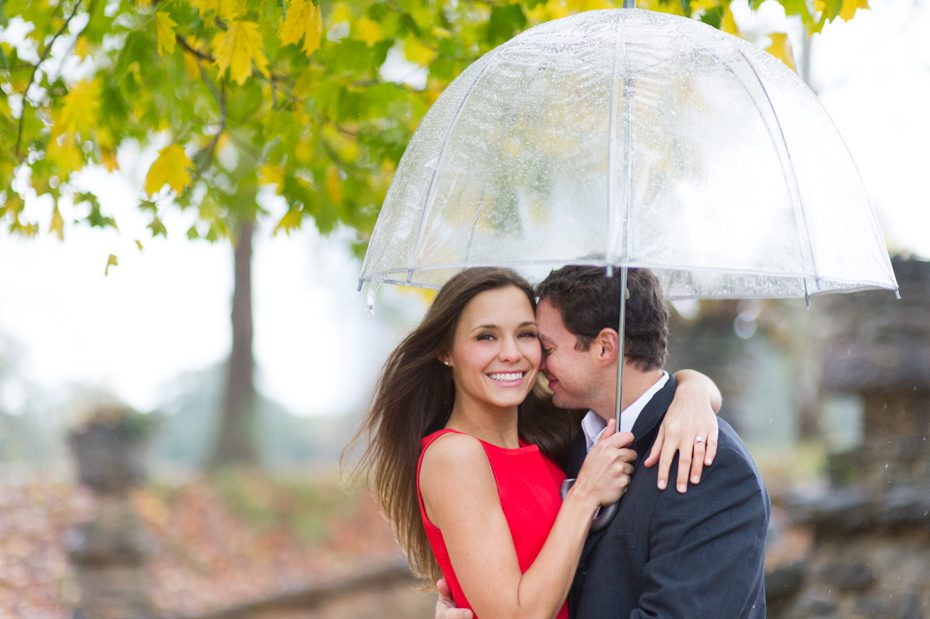Engagement photos with umbrella on rainy day