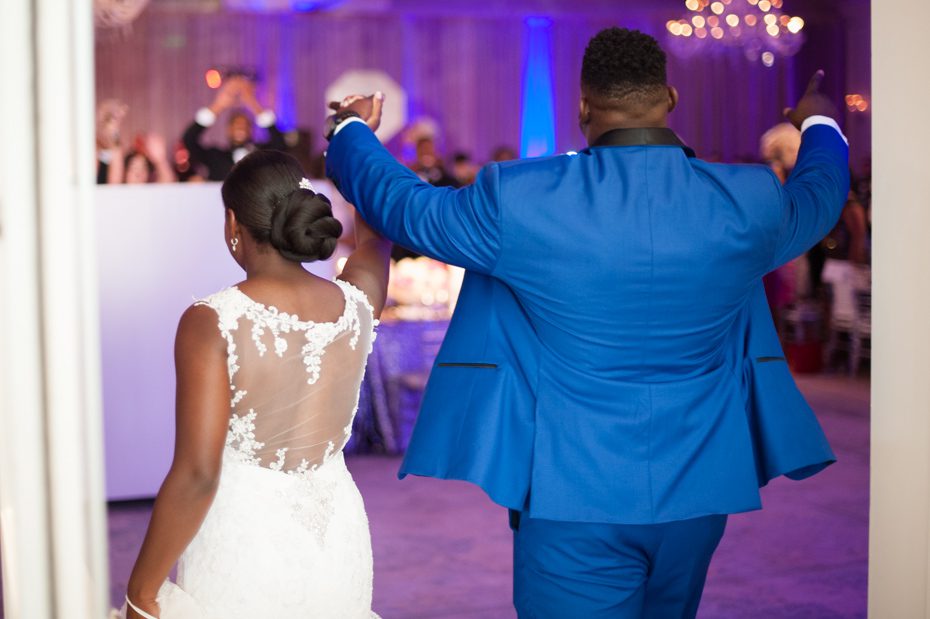 Geno Atkins and his wife entering their wedding reception at the St. Regis Atlanta