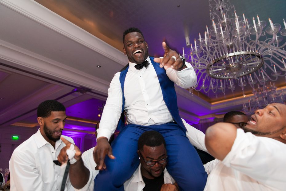 Geno Atkins on teammate's shoulders at wedding